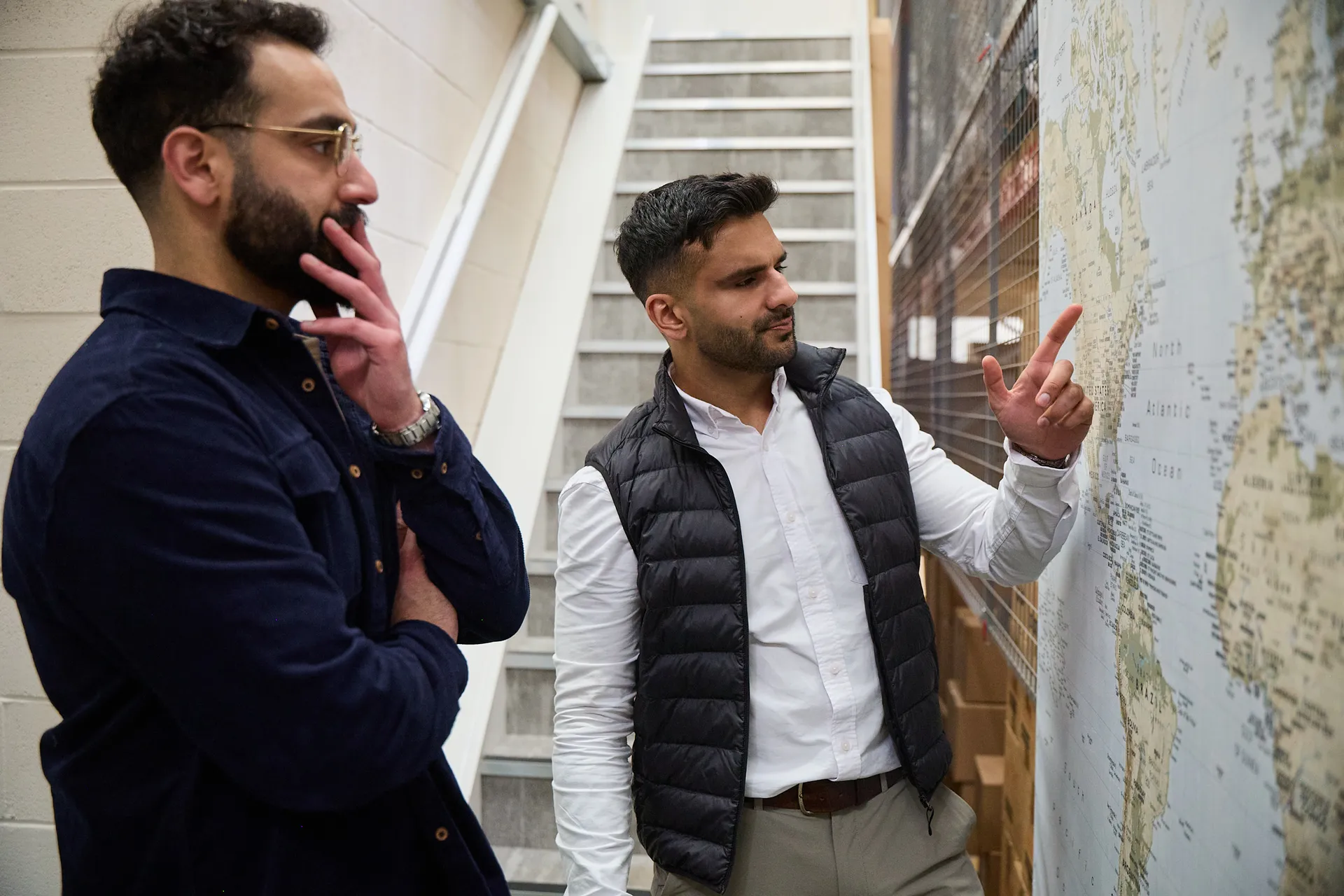World Products strategists planning a brand's marketplace expansion at a world map