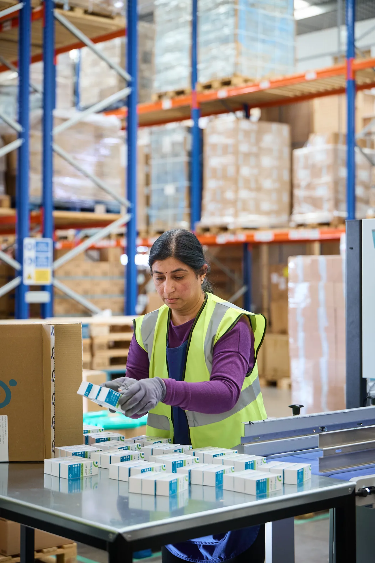 A World Products operative carrying out compliant FBA prep and labelling on healthcare units at the prep bench