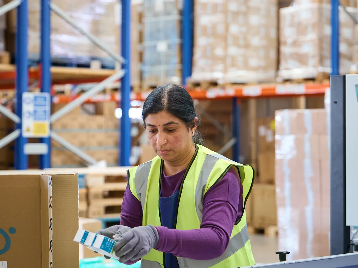 A World Products operative preparing stock in the fulfilment warehouse