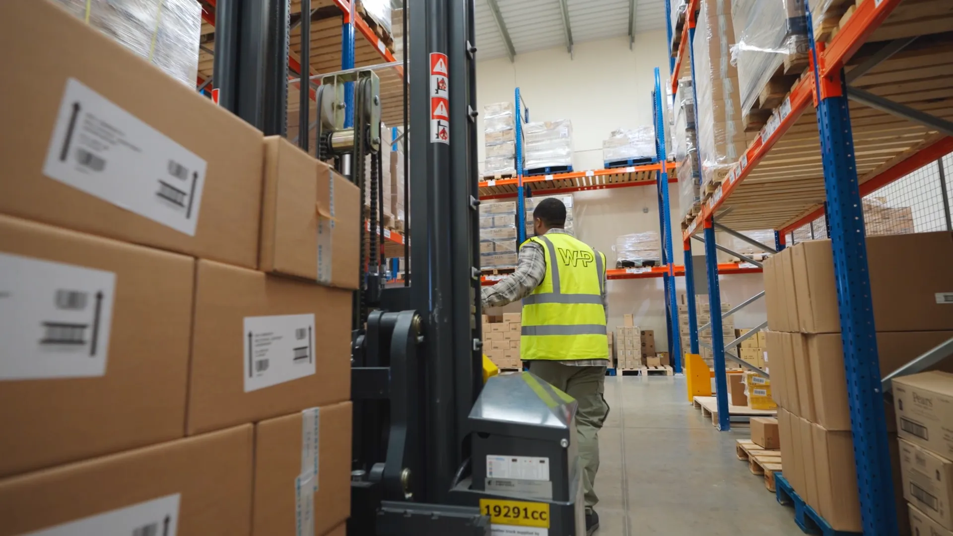 A World Products operative picking stock in the fulfilment warehouse